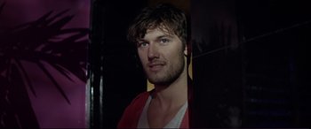 Movie still from “Magic Mike” (2012), directed by Steven Soderbergh – A person wearing a red shirt; Close Up shot, Over the shoulder angle