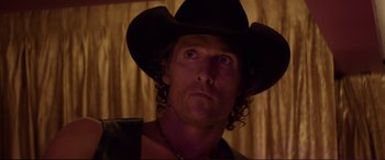 Movie still from “Magic Mike” (2012), directed by Steven Soderbergh – A person wearing a cowboy hat; Close Up shot, Over the shoulder angle
