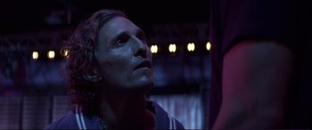 Movie still from “Magic Mike” (2012), directed by Steven Soderbergh – A person looking up at the sky; Close Up shot, Low angle