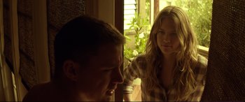 Movie still from “Magic Mike” (2012), directed by Steven Soderbergh – A man and a woman sitting next to each other in front of a window; Medium shot, Over the shoulder angle