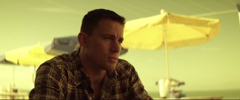 Movie still from “Magic Mike” (2012), directed by Steven Soderbergh – A person wearing a plaid shirt; Close Up shot, Low angle