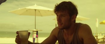 Movie still from “Magic Mike” (2012), directed by Steven Soderbergh – A person sitting at a table; Close Up shot, Over the shoulder angle