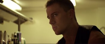 Movie still from “Magic Mike” (2012), directed by Steven Soderbergh – A man's face in a room; Close Up shot, Low angle