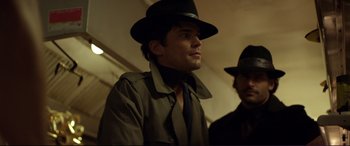 Movie still from “Magic Mike” (2012), directed by Steven Soderbergh – A man wearing a hat and a jacket; Close Up shot, Over the shoulder angle