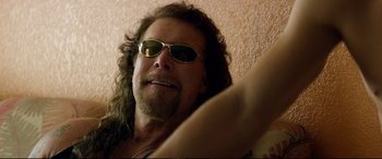 Movie still from “Magic Mike XXL” (2015), directed by Gregory Jacobs – A person wearing sunglasses; Close Up shot, Low angle