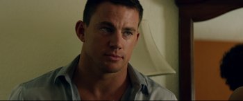 Movie still from “Magic Mike XXL” (2015), directed by Gregory Jacobs – A person wearing a button up shirt; Close Up shot, Over the shoulder angle