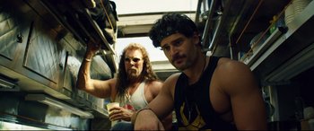Movie still from “Magic Mike XXL” (2015), directed by Gregory Jacobs – Two men are sitting on a bus together; Medium shot, Over the shoulder angle