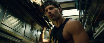 Movie still from “Magic Mike XXL” (2015), directed by Gregory Jacobs – A person wearing a tank top; Close Up shot, Low angle