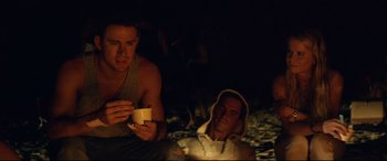 Movie still from “Magic Mike XXL” (2015), directed by Gregory Jacobs – Two men sitting on the ground in the dark; Medium shot, Low angle