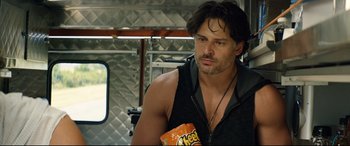 Movie still from “Magic Mike XXL” (2015), directed by Gregory Jacobs – A person holding a can of food; Close Up shot, Over the shoulder angle