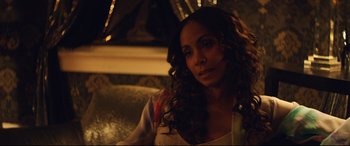 Movie still from “Magic Mike XXL” (2015), directed by Gregory Jacobs – A woman sitting on a couch in the dark; Close Up shot, Over the shoulder angle