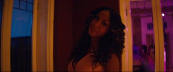 Movie still from “Magic Mike XXL” (2015), directed by Gregory Jacobs – A beautiful woman with long black hair posing for a picture; Close Up shot, High angle