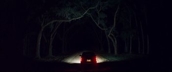 Movie still from “Magic Mike XXL” (2015), directed by Gregory Jacobs – A car is parked on the side of the road at night; Extreme Wide shot, Low angle