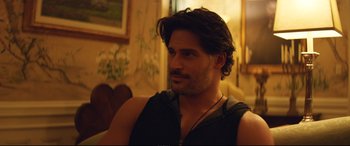 Movie still from “Magic Mike XXL” (2015), directed by Gregory Jacobs – A person sitting in a room; Close Up shot, Over the shoulder angle