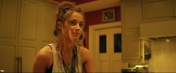 Movie still from “Magic Mike XXL” (2015), directed by Gregory Jacobs – A woman with a messy hair style is looking at the camera; Close Up shot, Over the shoulder angle