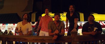 Movie still from “Magic Mike XXL” (2015), directed by Gregory Jacobs – A group of men standing next to each other on a bar; Medium shot, Low angle