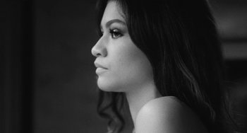 Movie still from “Malcolm & Marie” (2021), directed by Sam Levinson – A black - and - white photo of a woman with long hair; Close Up shot, Low angle