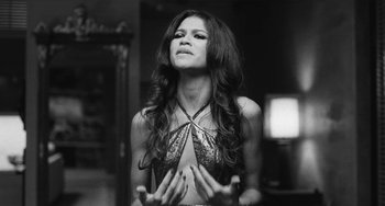 Movie still from “Malcolm & Marie” (2021), directed by Sam Levinson – A black - and - white photo of a woman with long hair; Close Up shot, Low angle