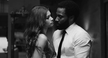 Movie still from “Malcolm & Marie” (2021), directed by Sam Levinson – A man and a woman standing next to each other; Close Up shot, Low angle