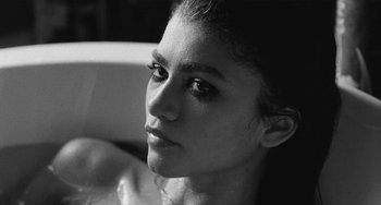 Movie still from “Malcolm & Marie” (2021), directed by Sam Levinson – Black and white photograph of a woman in a bathtub; Close Up shot, High angle