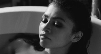 Movie still from “Malcolm & Marie” (2021), directed by Sam Levinson – A person with her eyes closed; Close Up shot, High angle