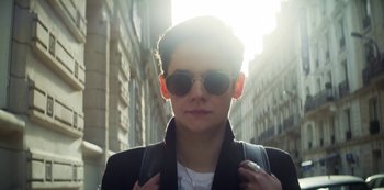 Movie still from “Marianne” (2019), created by Samuel Bodin – A person wearing sunglasses and a jacket; Close Up shot, Low angle
