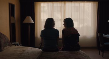 Movie still from “Lady Bird” (2017), directed by Greta Gerwig – Two women sitting in front of a window in a room; Medium shot, Over the shoulder angle