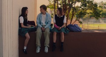 Movie still from “Lady Bird” (2017), directed by Greta Gerwig – A group of young people sitting on top of a bench; Medium shot, Over the shoulder angle