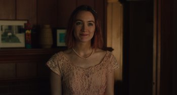 Movie still from “Lady Bird” (2017), directed by Greta Gerwig – A woman in a pink dress and a pearl necklace; Medium shot, Over the shoulder angle