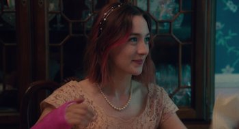 Movie still from “Lady Bird” (2017), directed by Greta Gerwig – A woman with pink hair wearing a pink headband; Close Up shot, Over the shoulder angle