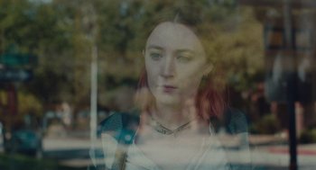 Movie still from “Lady Bird” (2017), directed by Greta Gerwig – A woman with red hair looking out of a window; Close Up shot, Over the shoulder angle