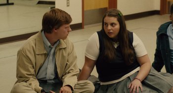 Movie still from “Lady Bird” (2017), directed by Greta Gerwig – A man and a woman sitting next to each other; Medium shot, Over the shoulder angle