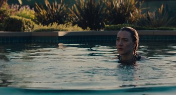 Movie still from “Lady Bird” (2017), directed by Greta Gerwig – A woman in the water in a swimming pool; Close Up shot, High angle