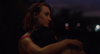 Movie still from “Lady Bird” (2017), directed by Greta Gerwig – A woman with red hair is hugging another woman; Close Up shot, Over the shoulder angle