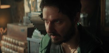 Movie still from “Marianne” (2019), created by Samuel Bodin – A person wearing a green shirt; Close Up shot, Over the shoulder angle