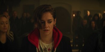 Movie still from “Marianne” (2019), created by Samuel Bodin – A person with a red hoodie is looking at the camera; Close Up shot, Over the shoulder angle