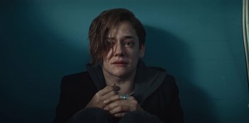 Movie still from “Marianne” (2019), created by Samuel Bodin – A person with a ring in their hand; Close Up shot, High angle