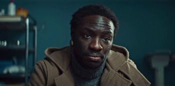 Movie still from “Marianne” (2019), created by Samuel Bodin – A person wearing a jacket; Close Up shot, Low angle