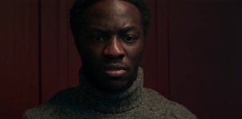 Movie still from “Marianne” (2019), created by Samuel Bodin – A person wearing a sweater; Close Up shot, Low angle