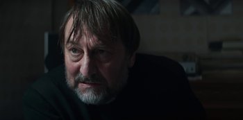 Movie still from “Marianne” (2019), created by Samuel Bodin – A person wearing a black shirt; Close Up shot, Over the shoulder angle