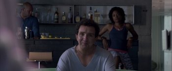 Movie still from “Miami Vice” (2006), directed by Michael Mann – A man and a woman in front of a bar; Close Up shot, Low angle