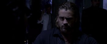 Movie still from “Miami Vice” (2006), directed by Michael Mann – A person wearing a black shirt; Close Up shot, Over the shoulder angle