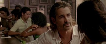 Movie still from “Miami Vice” (2006), directed by Michael Mann – A man with long hair and a mustache; Close Up shot, Over the shoulder angle