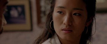 Movie still from “Miami Vice” (2006), directed by Michael Mann – A person with long brown hair; Close Up shot, Over the shoulder angle