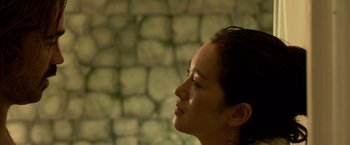 Movie still from “Miami Vice” (2006), directed by Michael Mann – A person looking to the side; Close Up shot, Low angle