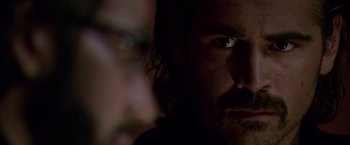 Movie still from “Miami Vice” (2006), directed by Michael Mann – A person's face in the dark; Extreme Close Up shot, Over the shoulder angle