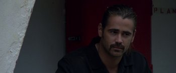 Movie still from “Miami Vice” (2006), directed by Michael Mann – A person wearing a black shirt; Close Up shot, Over the shoulder angle