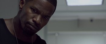 Movie still from “Miami Vice” (2006), directed by Michael Mann – A person with a black shirt; Close Up shot, Low angle