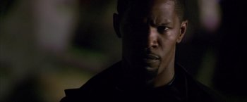 Movie still from “Miami Vice” (2006), directed by Michael Mann – A man's face in the dark; Close Up shot, Low angle