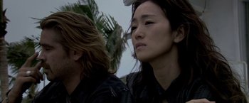 Movie still from “Miami Vice” (2006), directed by Michael Mann – A woman and a man in black leather jackets looking into the distance; Close Up shot, Low angle